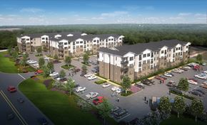 Huntsville apartment for rent - A large apartment complex with a parking lot in front.