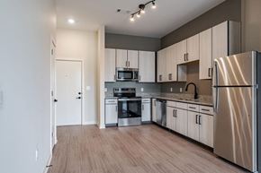 Huntsville apartment for rent - A kitchen with wooden floors and stainless steel appliances.