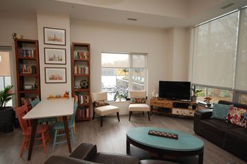 Halifax apartment for rent - A living room with a white table and a couch.