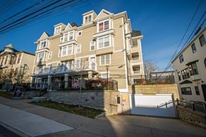 Halifax apartment for rent - A large, multi-story building with a gated entrance and a "No Trespassing" sign in front.