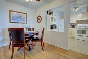 Dartmouth apartment for rent - A dining room with a wooden table and chairs.