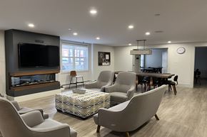 Dartmouth apartment for rent - A living room with a fireplace and a television.