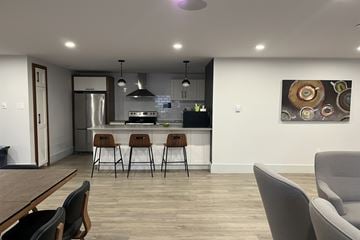 Dartmouth apartment for rent - A modern kitchen with a dining table and chairs.