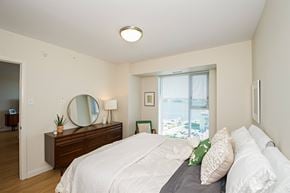Halifax apartment for rent - A bedroom with a large bed and a mirror on the dresser.