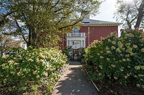 Dartmouth apartment for rent - A pathway leads to a building with a balcony.