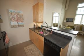 Dartmouth apartment for rent - A kitchen with a black counter top and wooden cabinets.