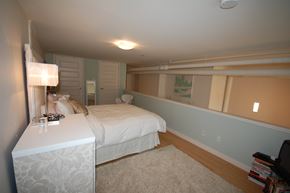 Dartmouth apartment for rent - A bedroom with a bed, nightstand, and lamp.