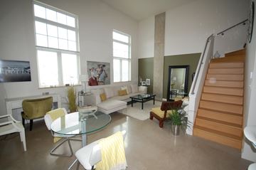 Dartmouth apartment for rent - A living room with a glass table and white couches.