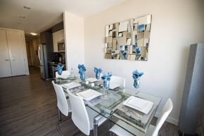 Halifax apartment for rent - A modern dining room with a glass table and white chairs.