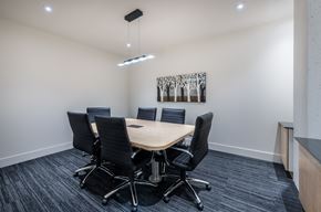 Dartmouth apartment for rent - A conference room with a table, chairs, and a painting on the wall.