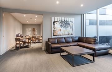 Dartmouth apartment for rent - A living room with a brown leather couch and a coffee table.