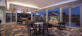 Halifax apartment for rent - A modern dining room with a large table and chairs.