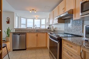 Halifax apartment for rent - A kitchen with wooden cabinets and granite countertops.