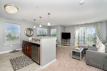 Camp Hill apartment for rent - A well-lit, spacious kitchen and living room with a television and a couch.