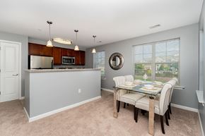 Camp Hill apartment for rent - A kitchen with a table and chairs in front of a window.