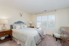 Camp Hill apartment for rent - A bedroom with a bed, nightstands, and a window.