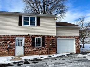 Red Lion apartment for rent - A house with a white garage door and a brown door.