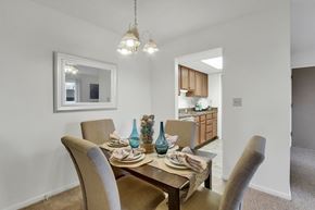 Indiana apartment for rent - A dining room with a table set for two.