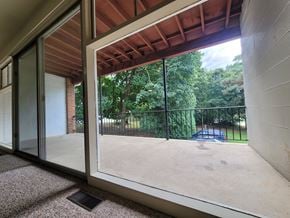 Dallastown apartment for rent - A view from inside a building looking out through a sliding glass door.