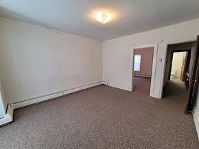 Red Lion apartment for rent - A room with a carpeted floor and a ceiling light.