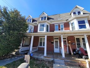 Red Lion apartment for rent - A red brick house with white trim and a white door.