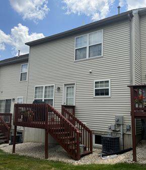 York apartment for rent - A house with a grey siding and a brown deck.