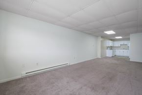 Duncannon apartment for rent - A large empty room with carpeted floor and white walls.