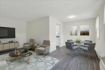 Dover apartment for rent - A living room with a grey sofa and a coffee table.