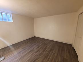 Mount Wolf apartment for rent - A room with wooden flooring and a window.