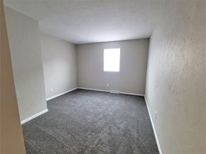 York apartment for rent - A room with a carpeted floor and a window.