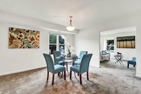 Virginia Beach apartment for rent - A dining room with a table set for two and a painting on the wall.