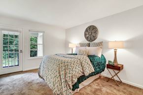 Virginia Beach apartment for rent - A bedroom with a large bed and a window.