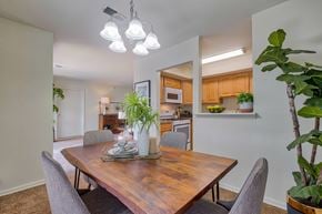 York apartment for rent - A dining room with a wooden table and grey chairs.