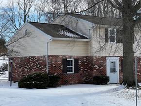 Red Lion apartment for rent - A house with a white door and a brick wall.