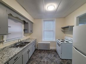 Wrightsville apartment for rent - A kitchen with a white stove and a window.