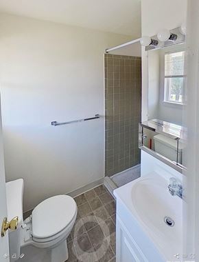 Redlion apartment for rent - A white toilet with a white sink and a white bathtub in a bathroom.
