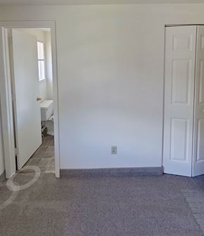 Redlion apartment for rent - A white door is open to a small bathroom.