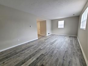 York apartment for rent - A room with wooden flooring and a window.