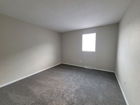York apartment for rent - A room with a carpeted floor and a window.
