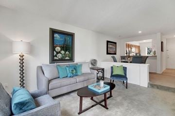 Richmond apartment for rent - A living room with a grey couch and a coffee table.