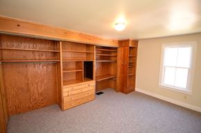 Wrightsville apartment for rent - A room with a large built-in bookcase and a window.