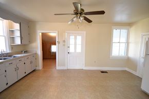 Wrightsville apartment for rent - A kitchen with white cabinets and a fan on the ceiling.