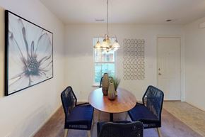 Suffolk apartment for rent - A dining room with a round table and chairs.