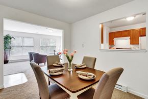 Hagerstown apartment for rent - A dining room with a table set for two and a potted plant.