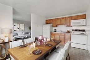 York apartment for rent - A modern kitchen with a dining table set for two.