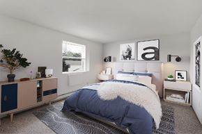York apartment for rent - A bedroom with a large bed and a wooden cabinet.