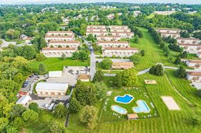 York apartment for rent - An aerial view of a residential area with a swimming pool.