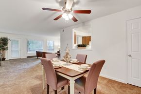 Hagerstown apartment for rent - A dining room with a table set for two and a ceiling fan.