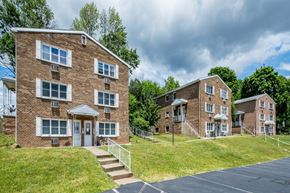 Duncannon apartment for rent - A large brick building with a white door and windows.