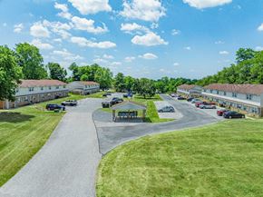 Dover apartment for rent - A sunny day at a park with a playground and a winding road.